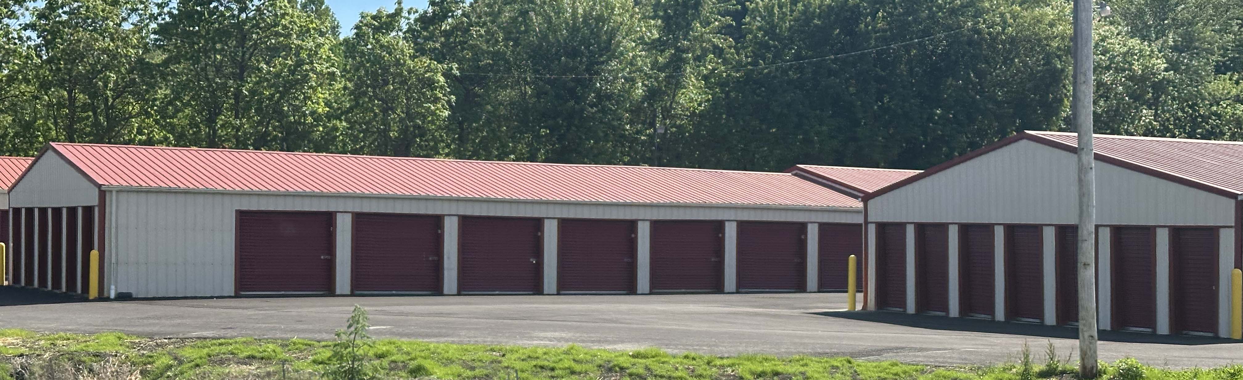 Side view of Holliday's Mini Storage buildings with Ohio hillside behind the property.